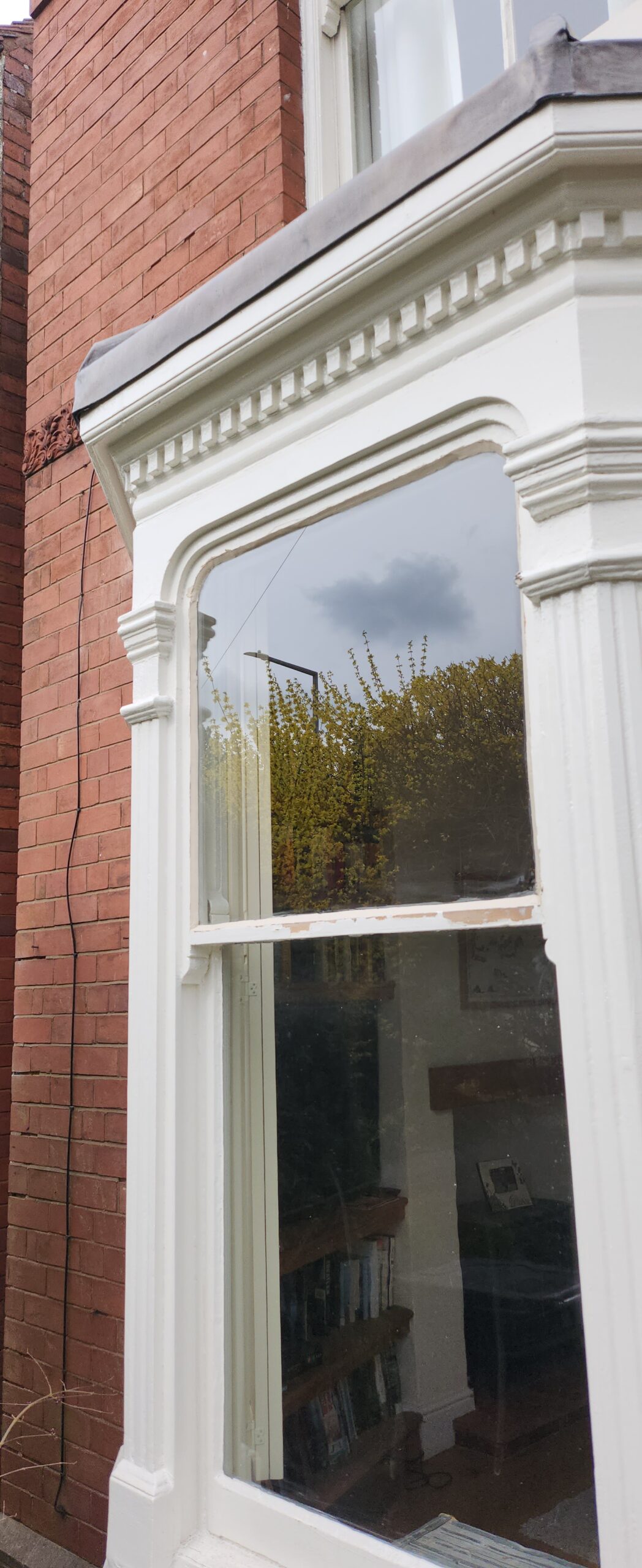 Home Wooden sash box window reglazed with new glass and putty by TLC Window Doctors