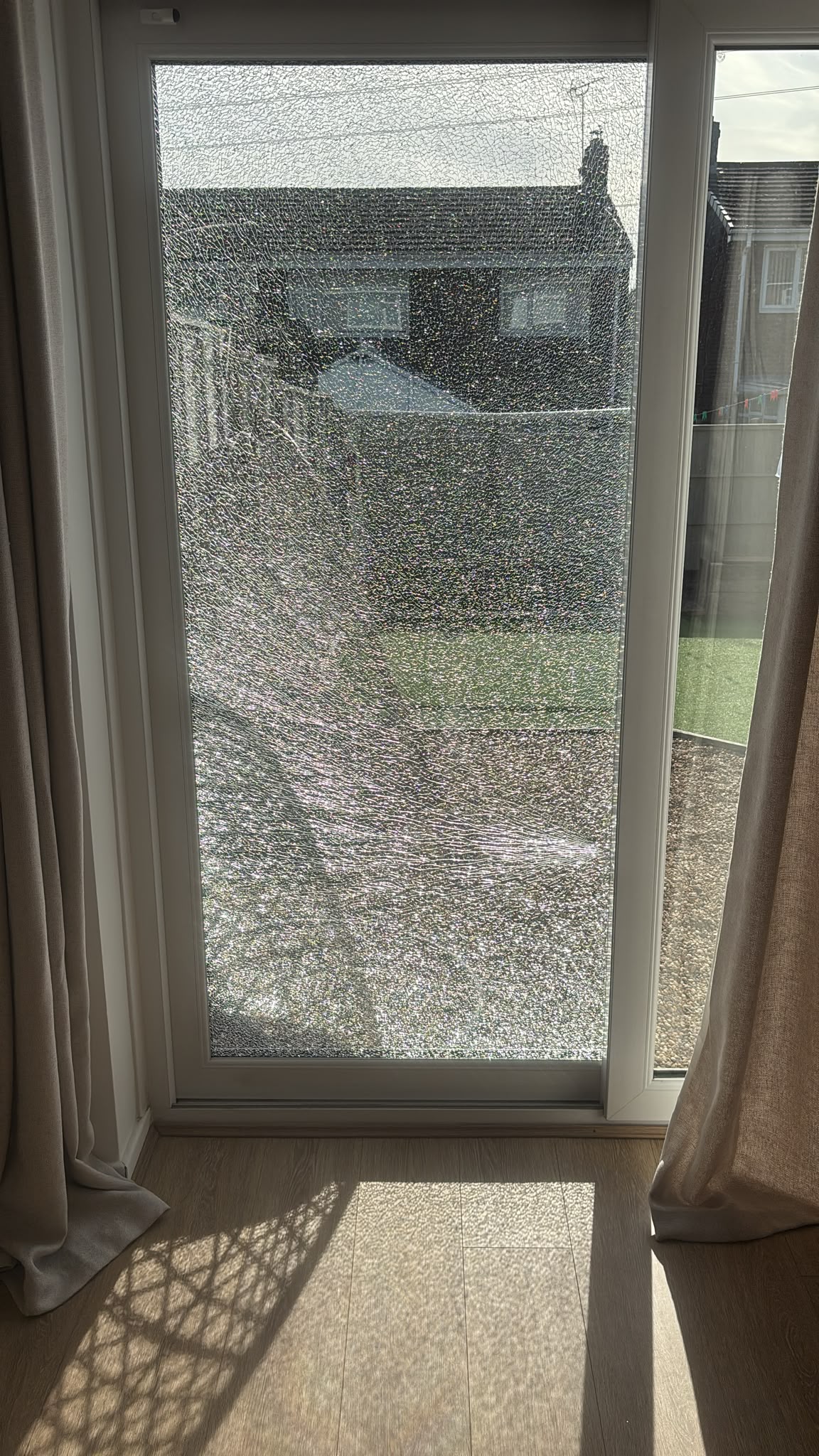 Home Shattered patio door glass before replacement by TLC Window Doctors